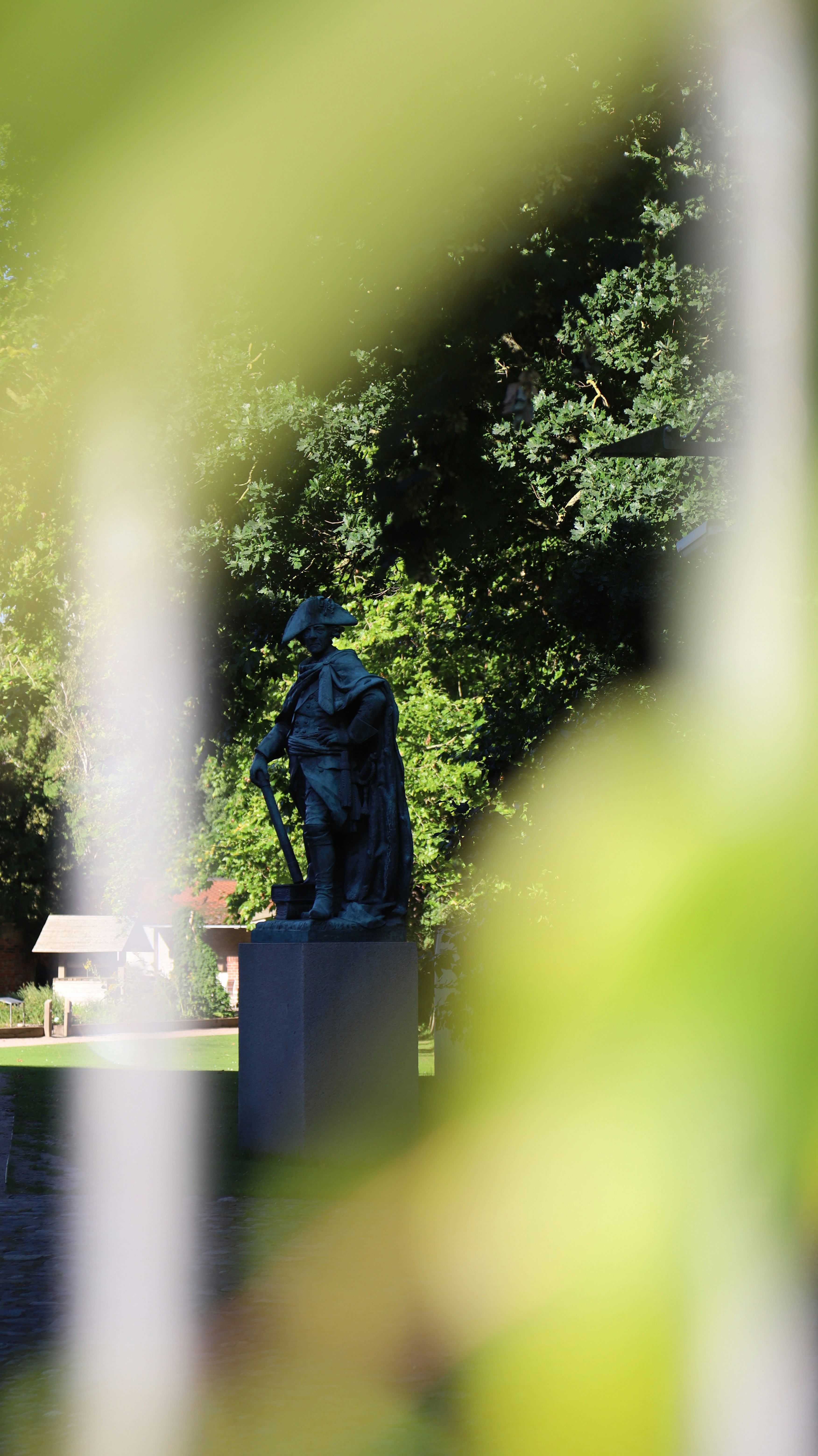 Statue of a man in a hat with shovel