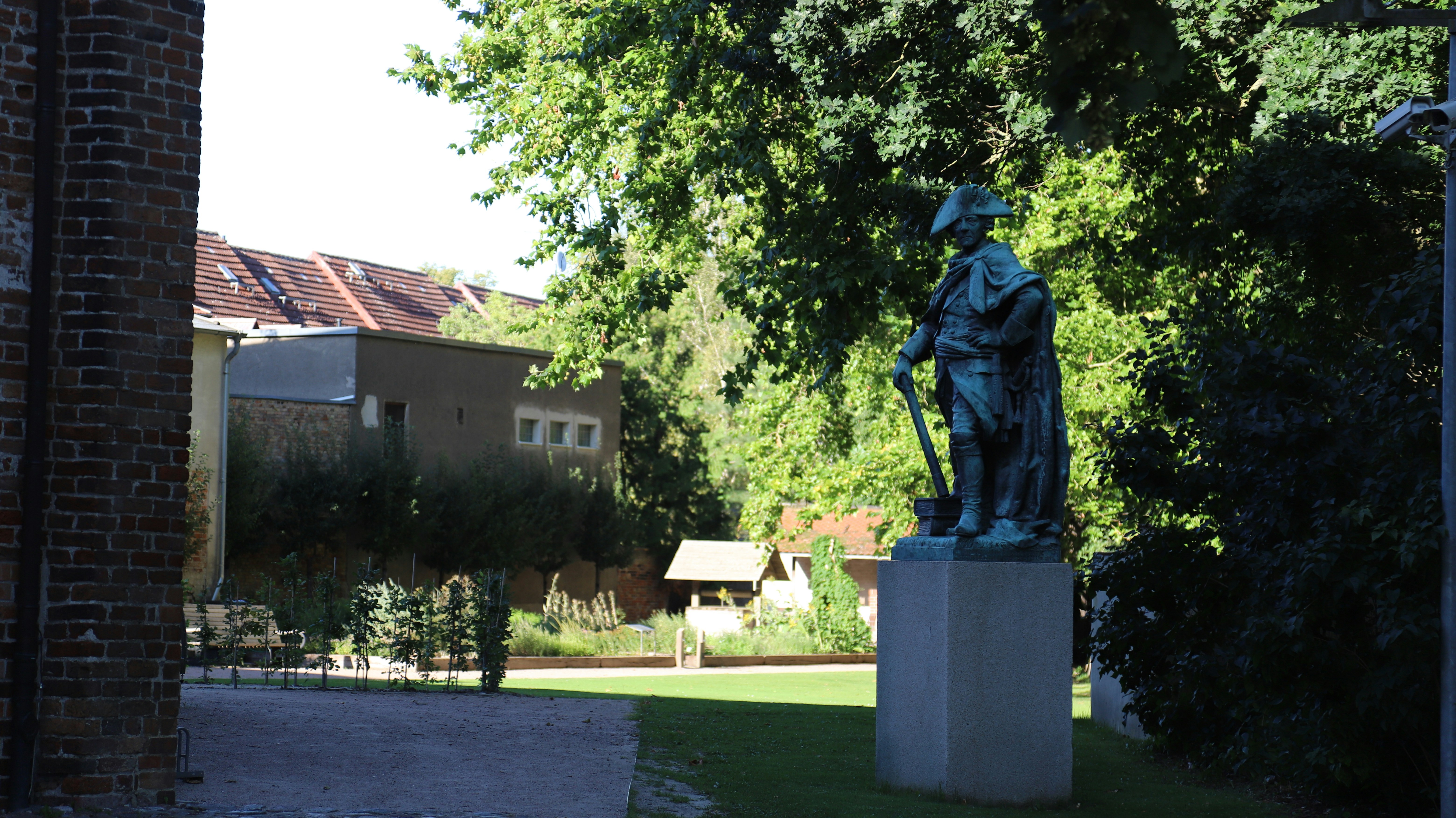 Bronze statue of a man in a park
