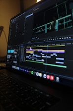 Video editing software interface on a laptop screen.