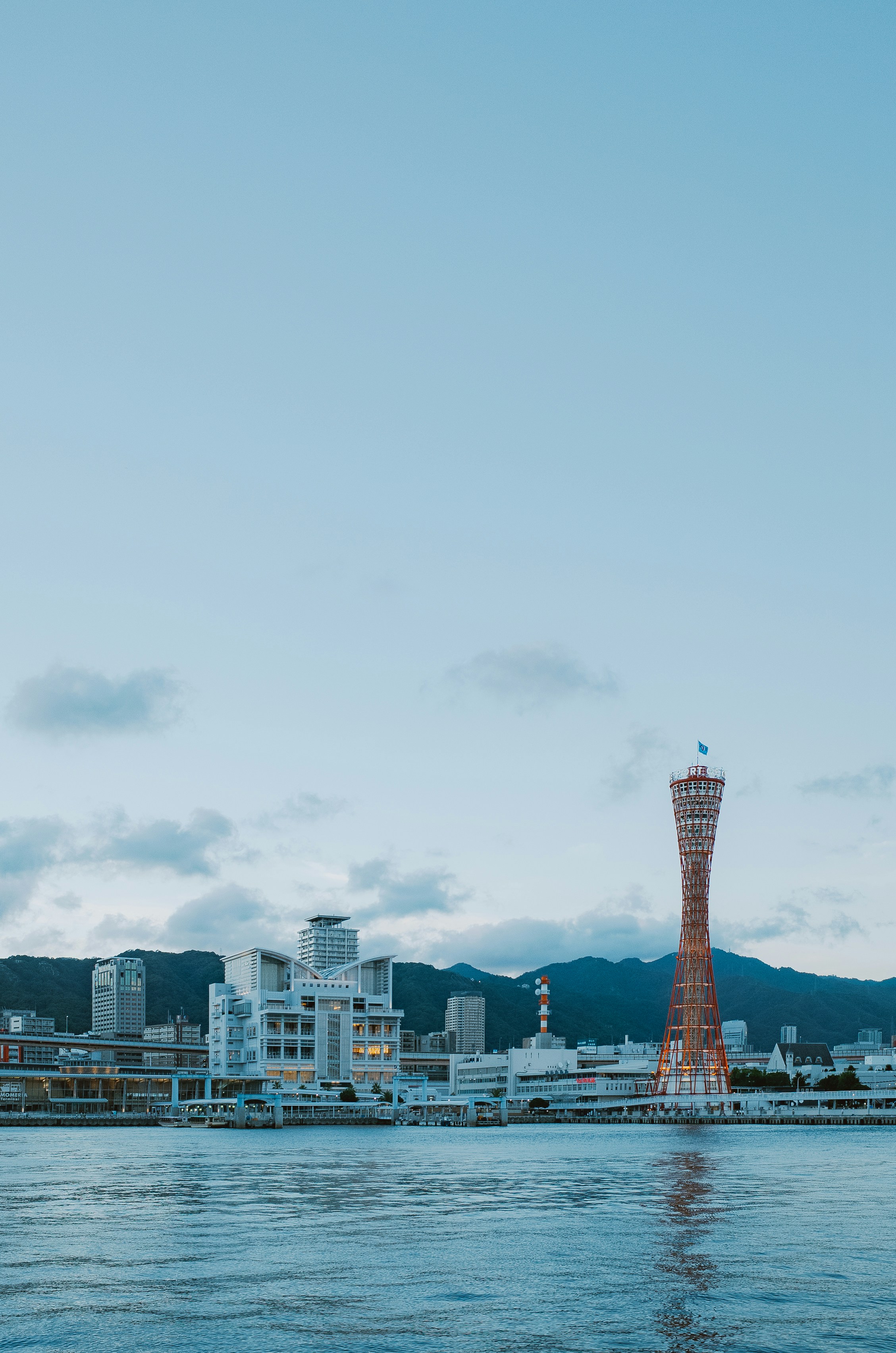 Kobe skyline with a tall red and white tower.
