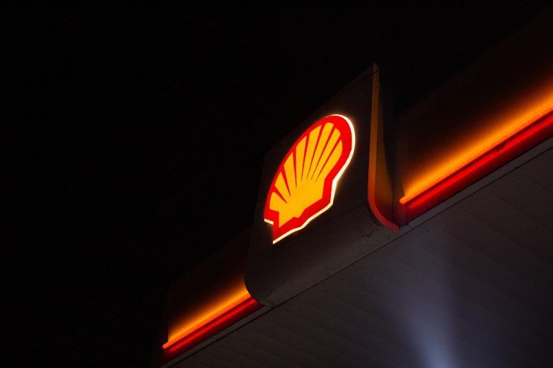 Shell logo illuminated at night with neon lights
