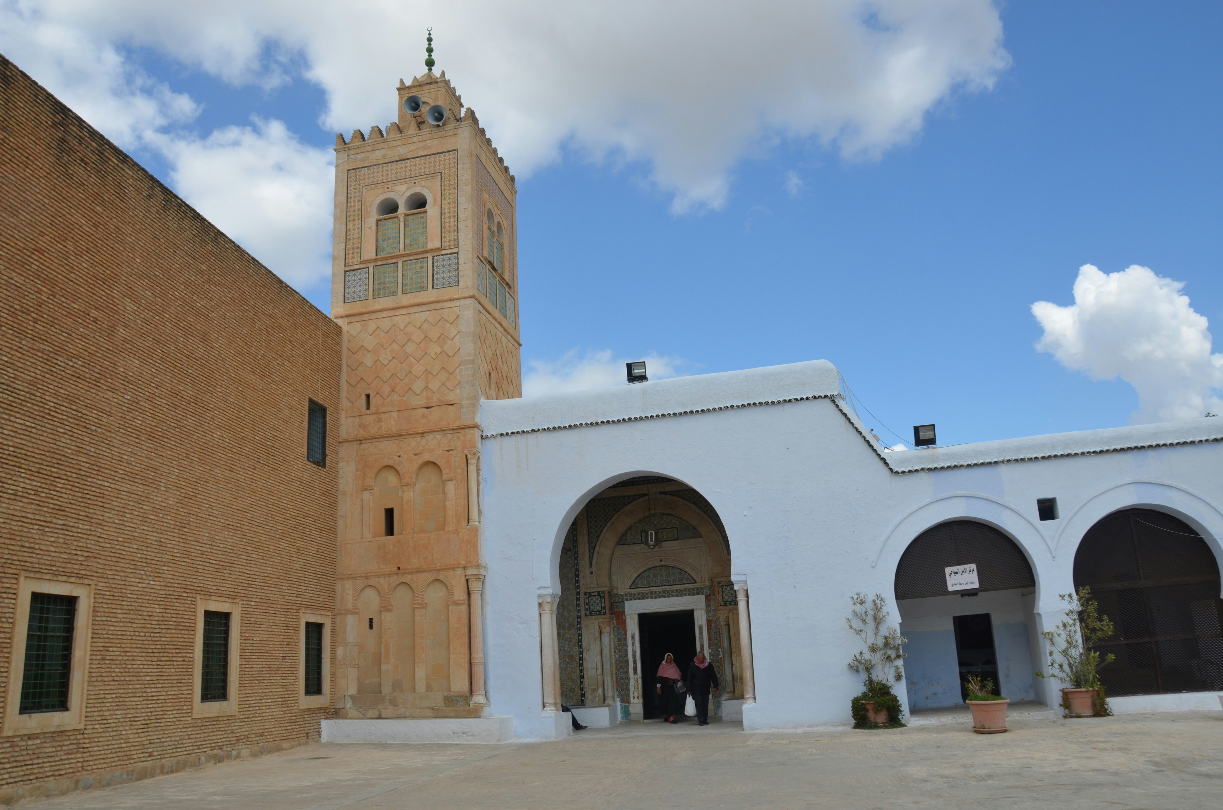 Historic mosque courtyard with a tall minaret