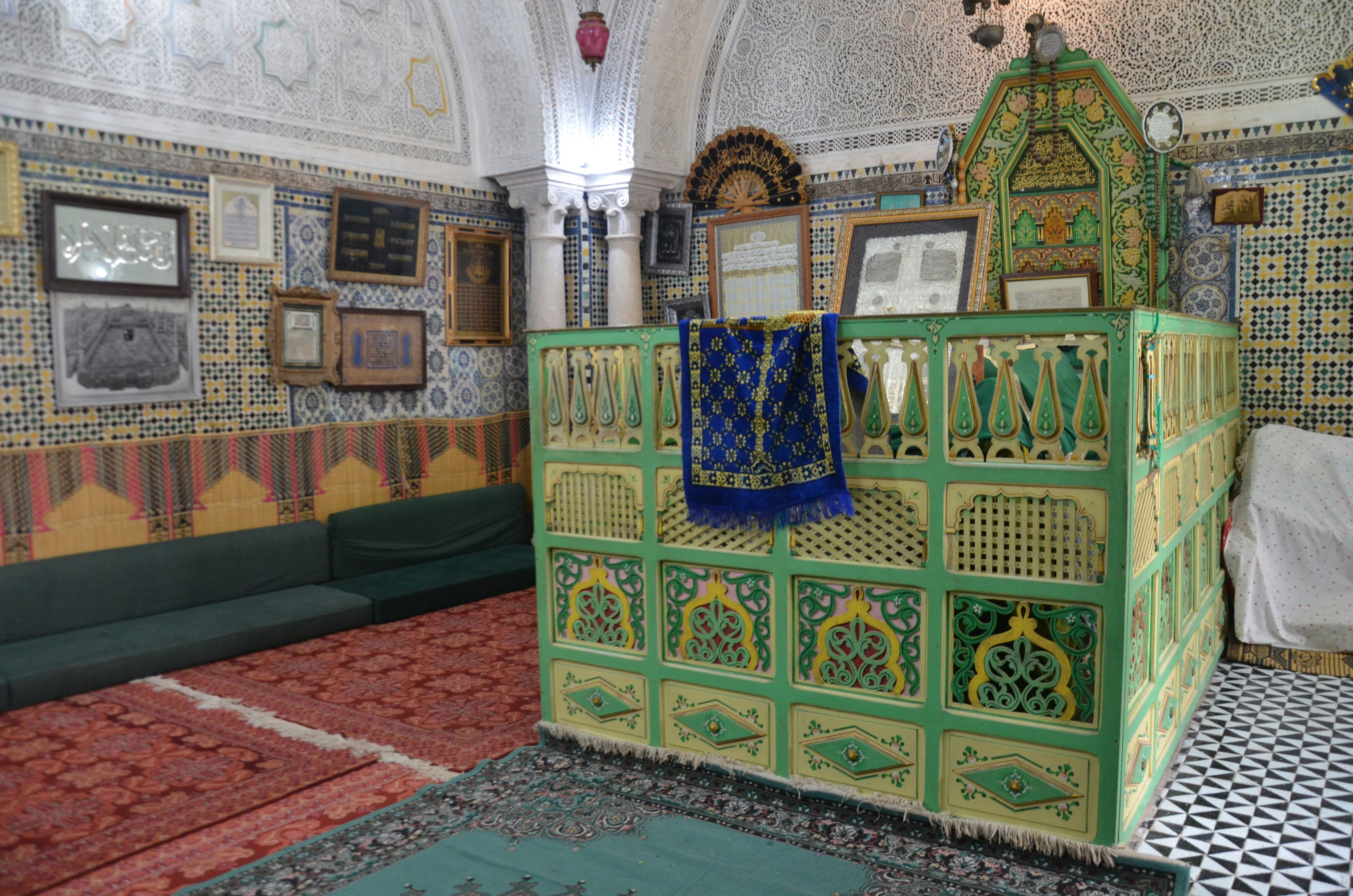 Ornate green tomb enclosure