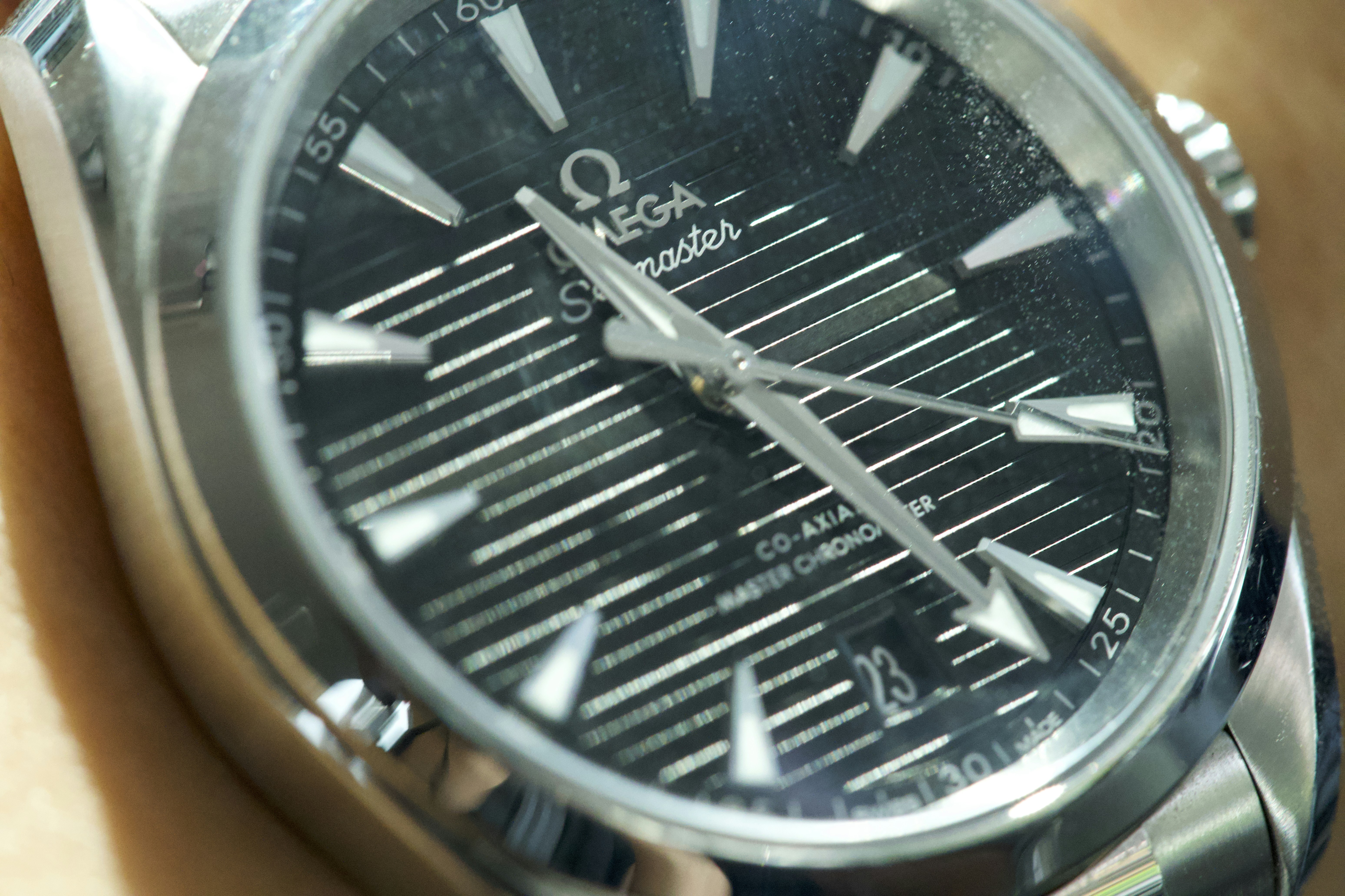 Close-up of a black omega watch face