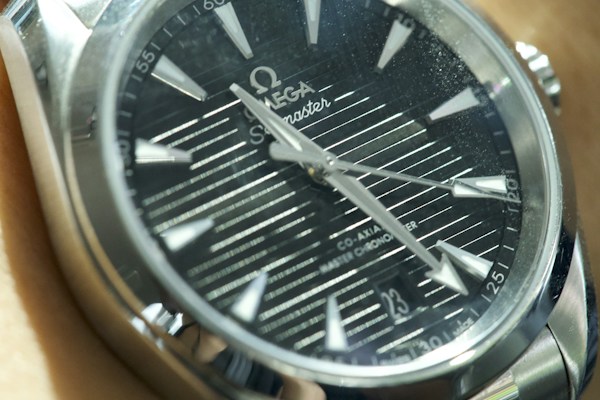 Luxury watch face through sapphire crystal close-up