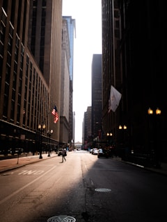 City street with tall buildings and bright sky