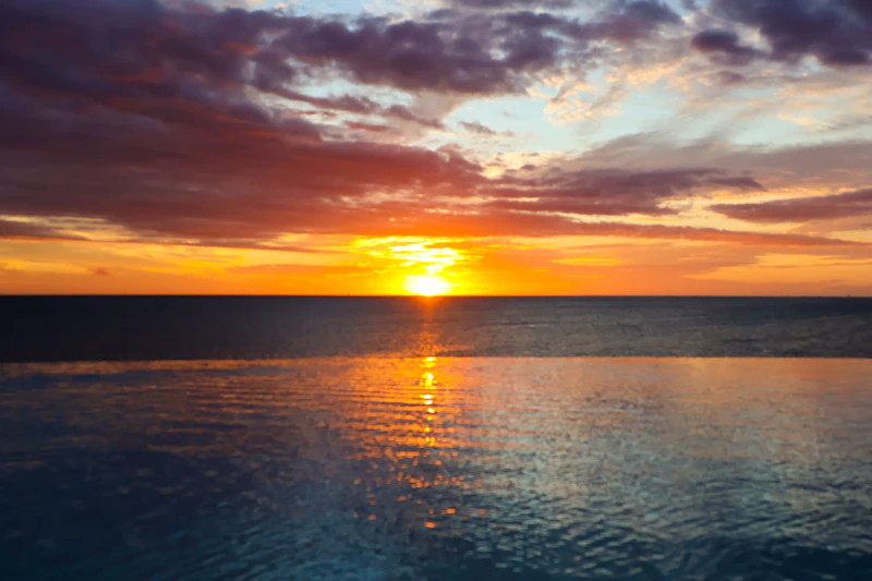 Golden sunset over calm ocean