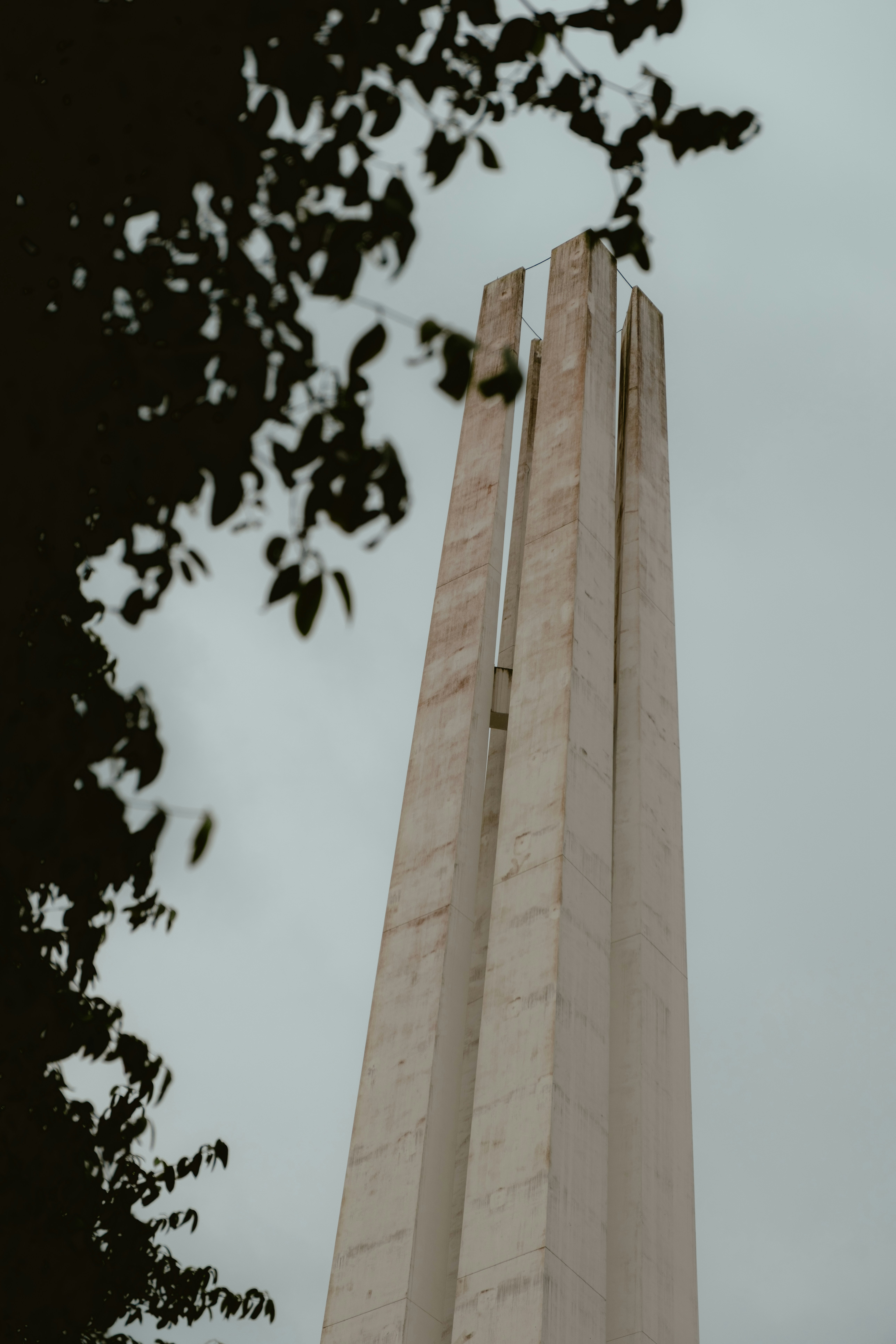 Tall concrete monument against a cloudy sky