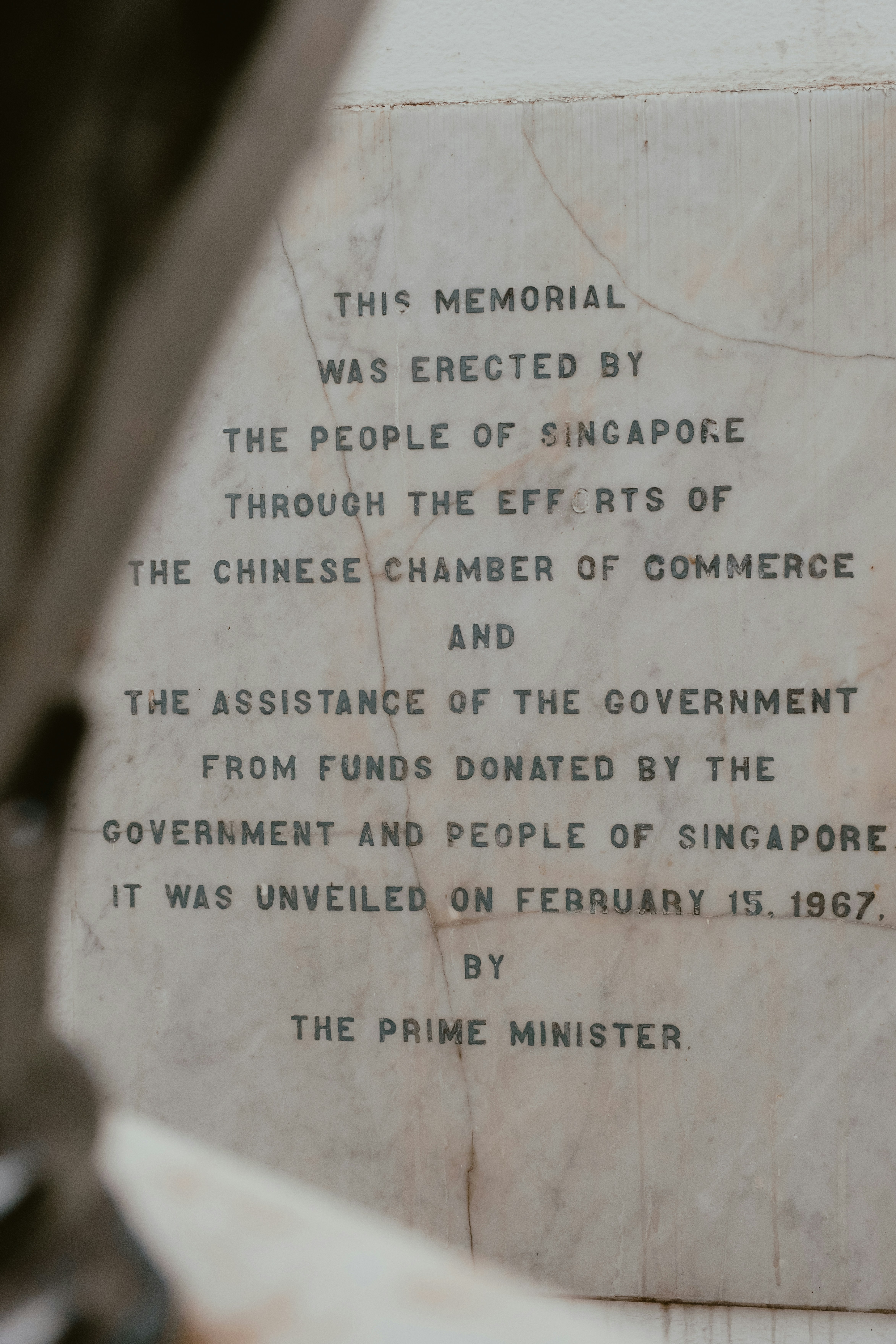 Memorial plaque with inscription detailing its erection.