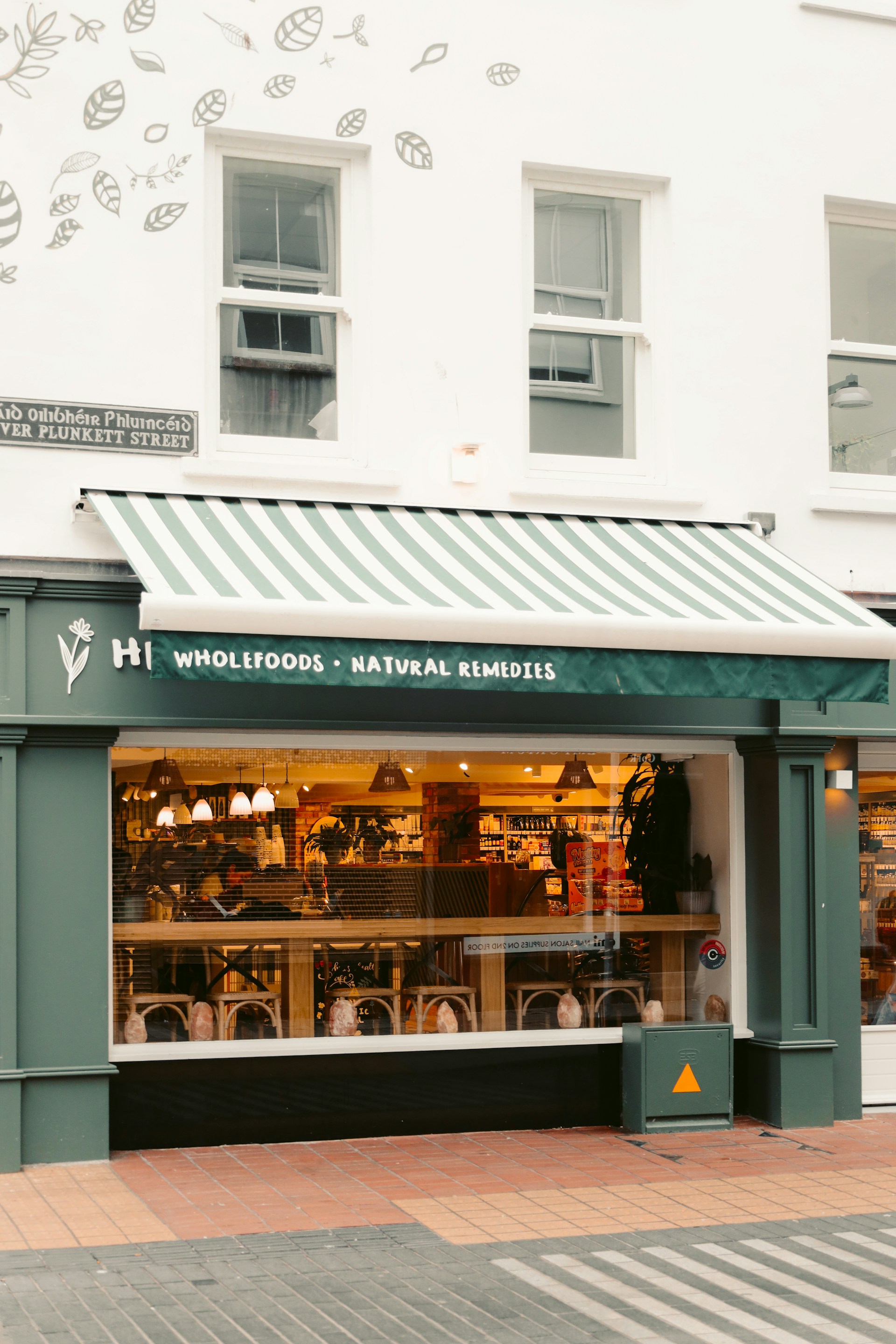 Storefront of a wholefoods and natural remedies shop.