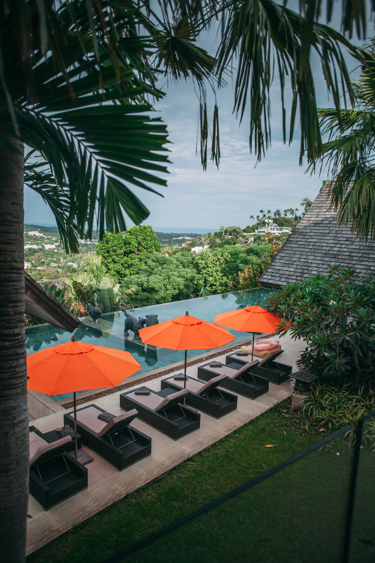 Luxury resort infinity pool with umbrellas