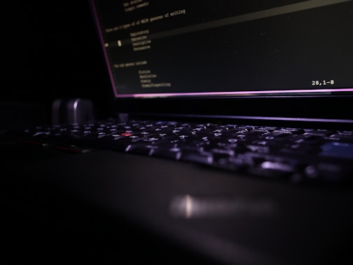 Close-up of a laptop keyboard in the dark