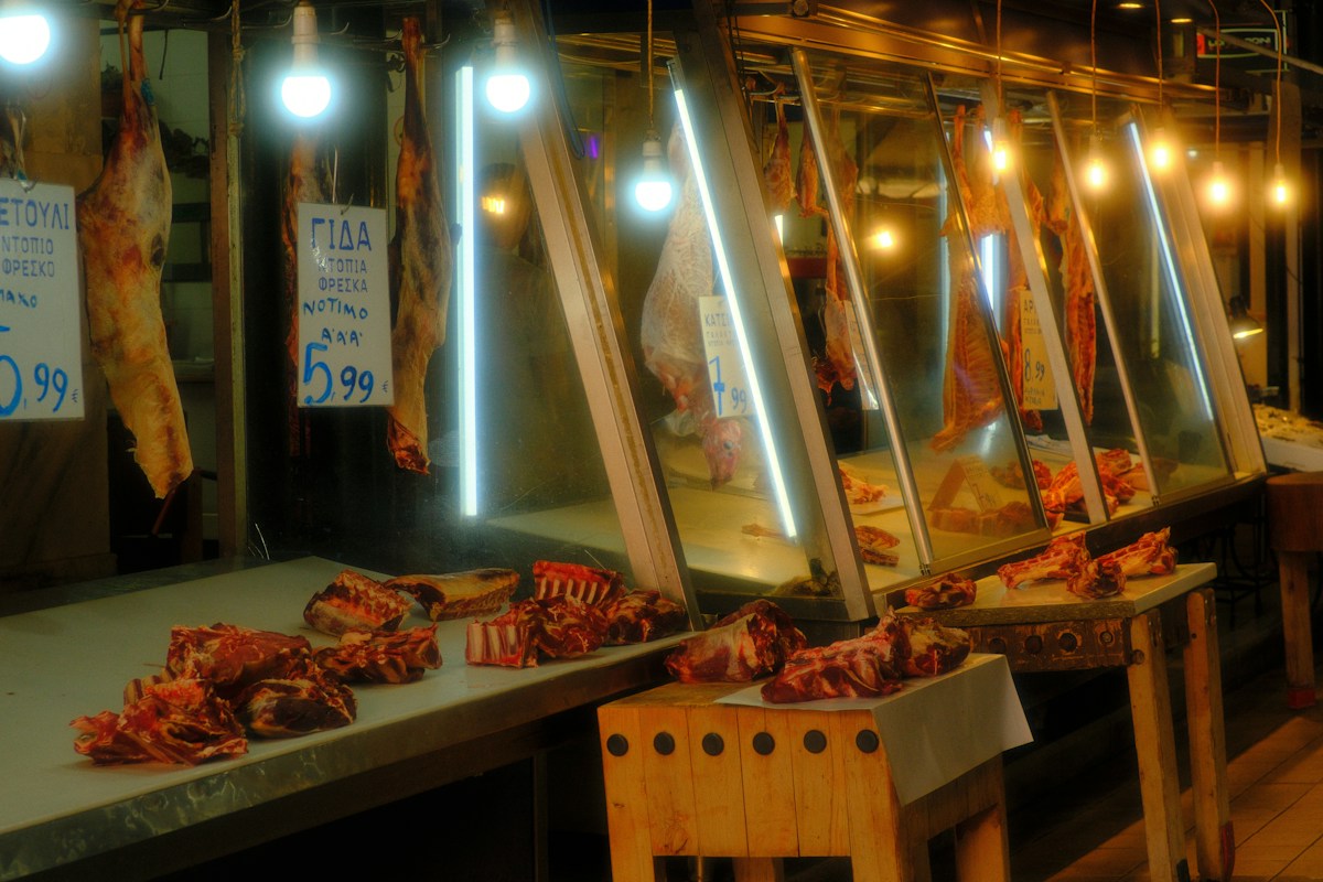Butcher shop counter with packaged meats ready for pickup