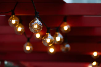 String lights glow against a red background