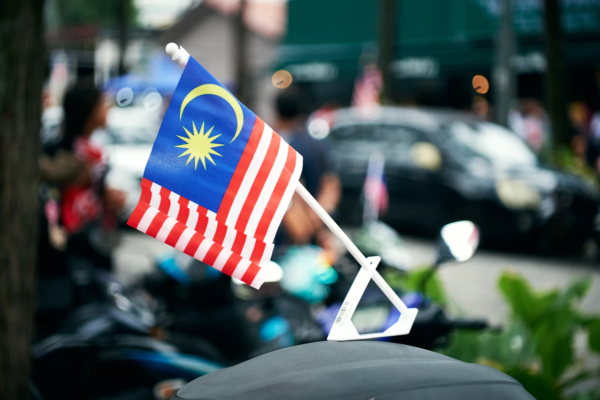 Malaysian flag waving on a pole