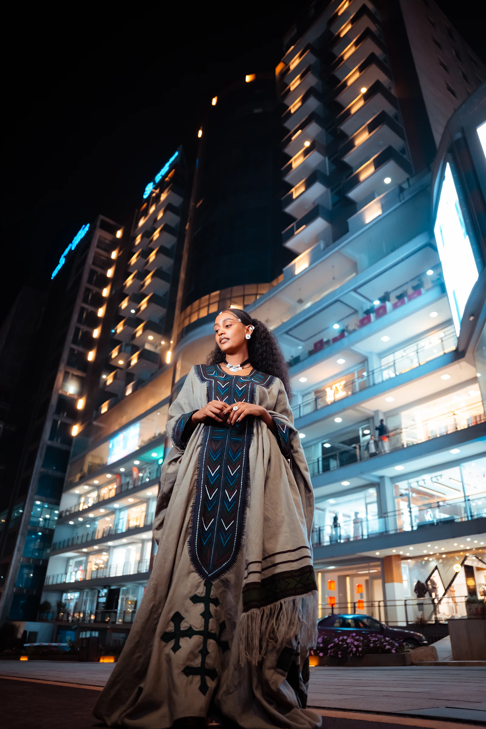 Woman in traditional Ethiopian dress in modern Addis Ababa
