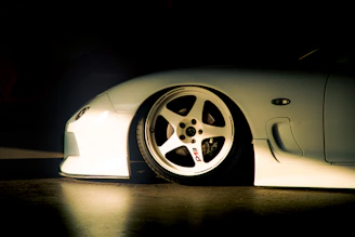 White sports car with custom wheels