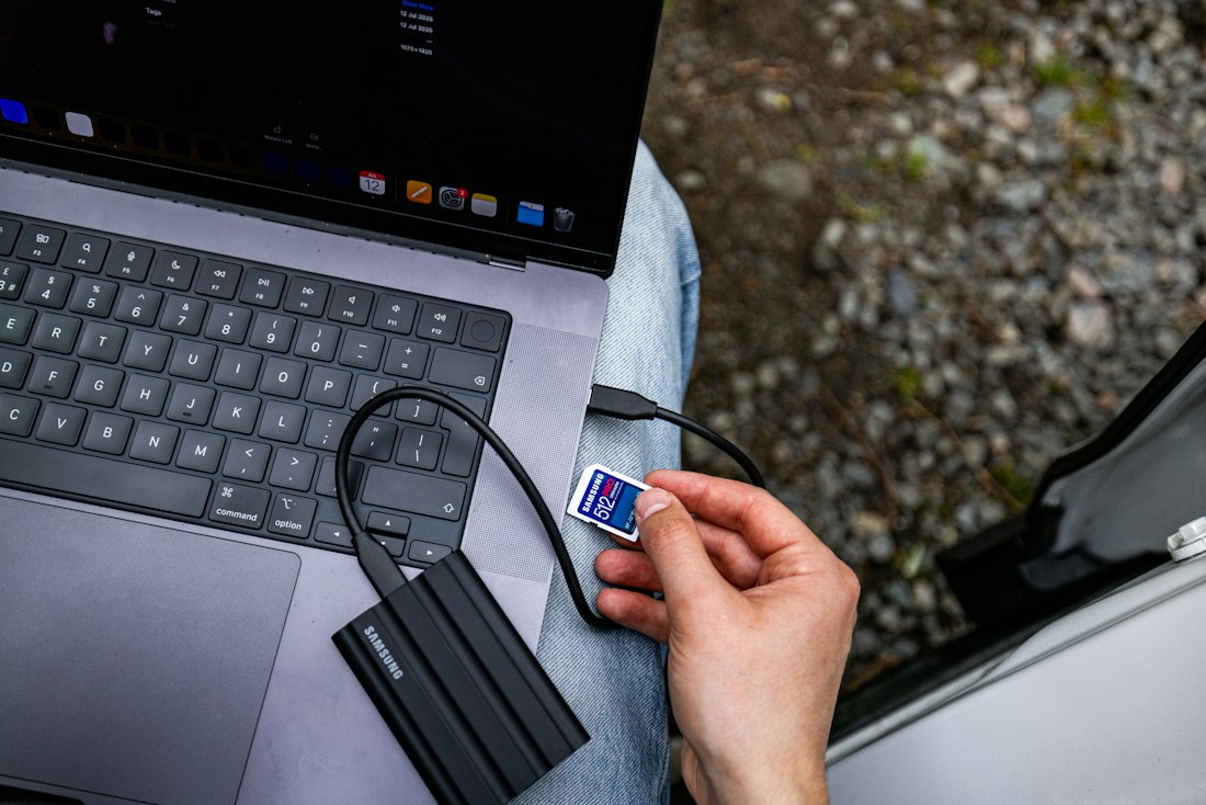 External hard drive connected to a laptop during a file transfer