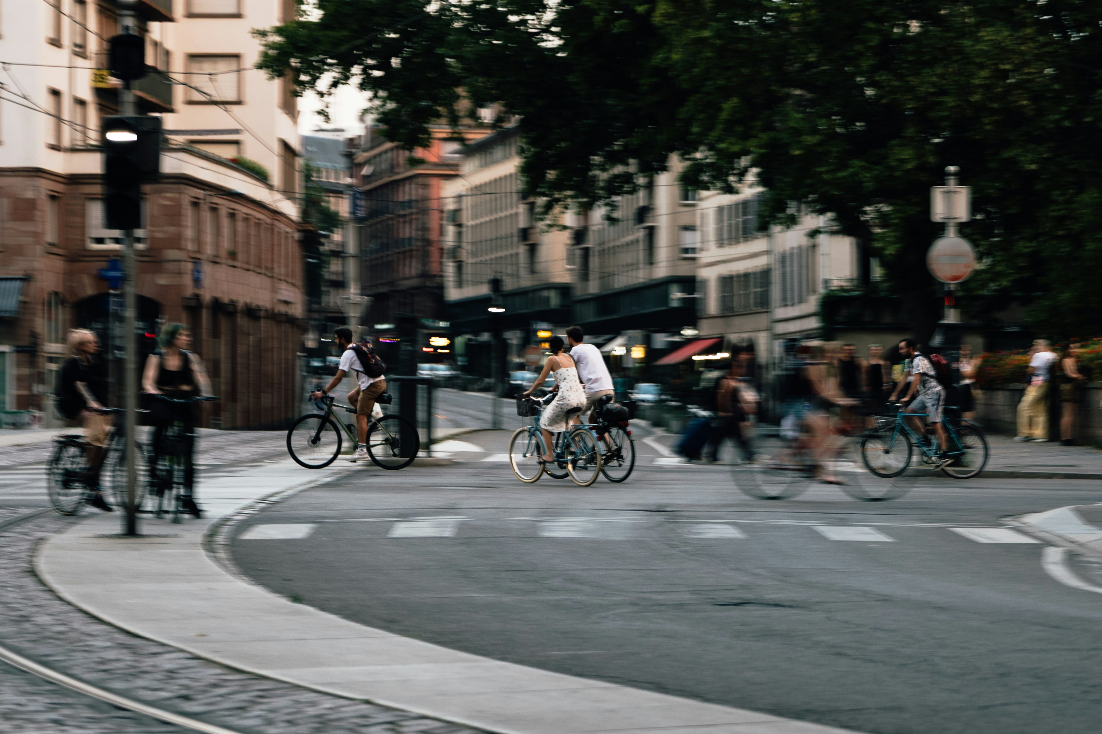 Cyclists crossing a street in a city