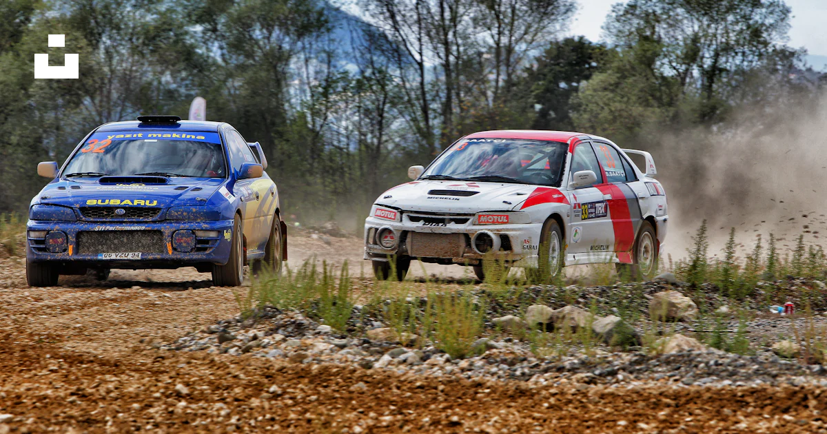 Two rally cars racing on a dirt track. photo – Free Car Image on Unsplash