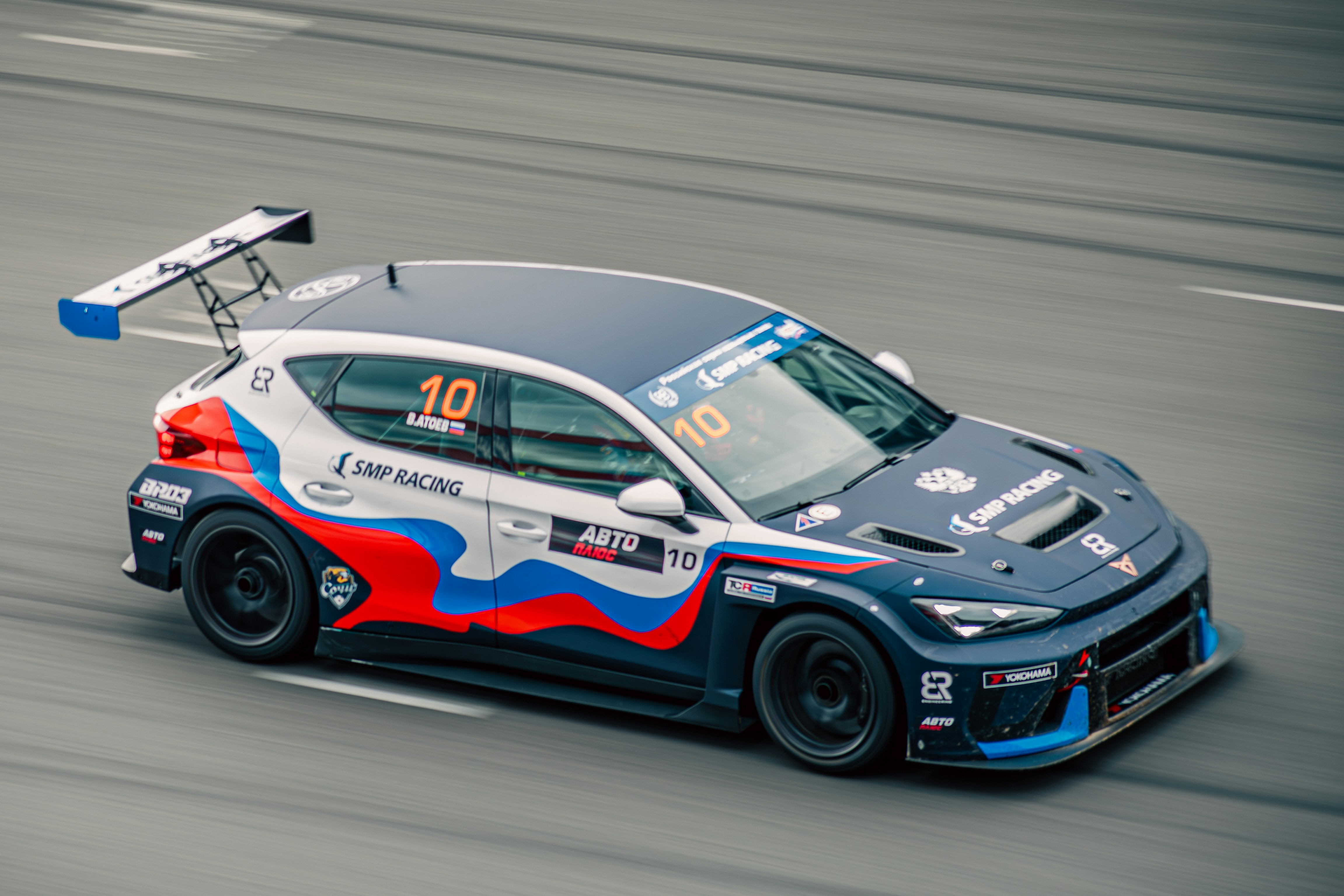 Race car with number 10 on track photo – Free Wallpaper Image on Unsplash