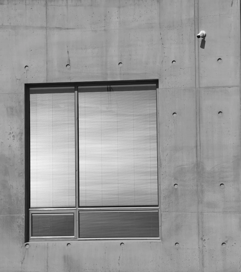 Modern commercial building with an exterior security camera