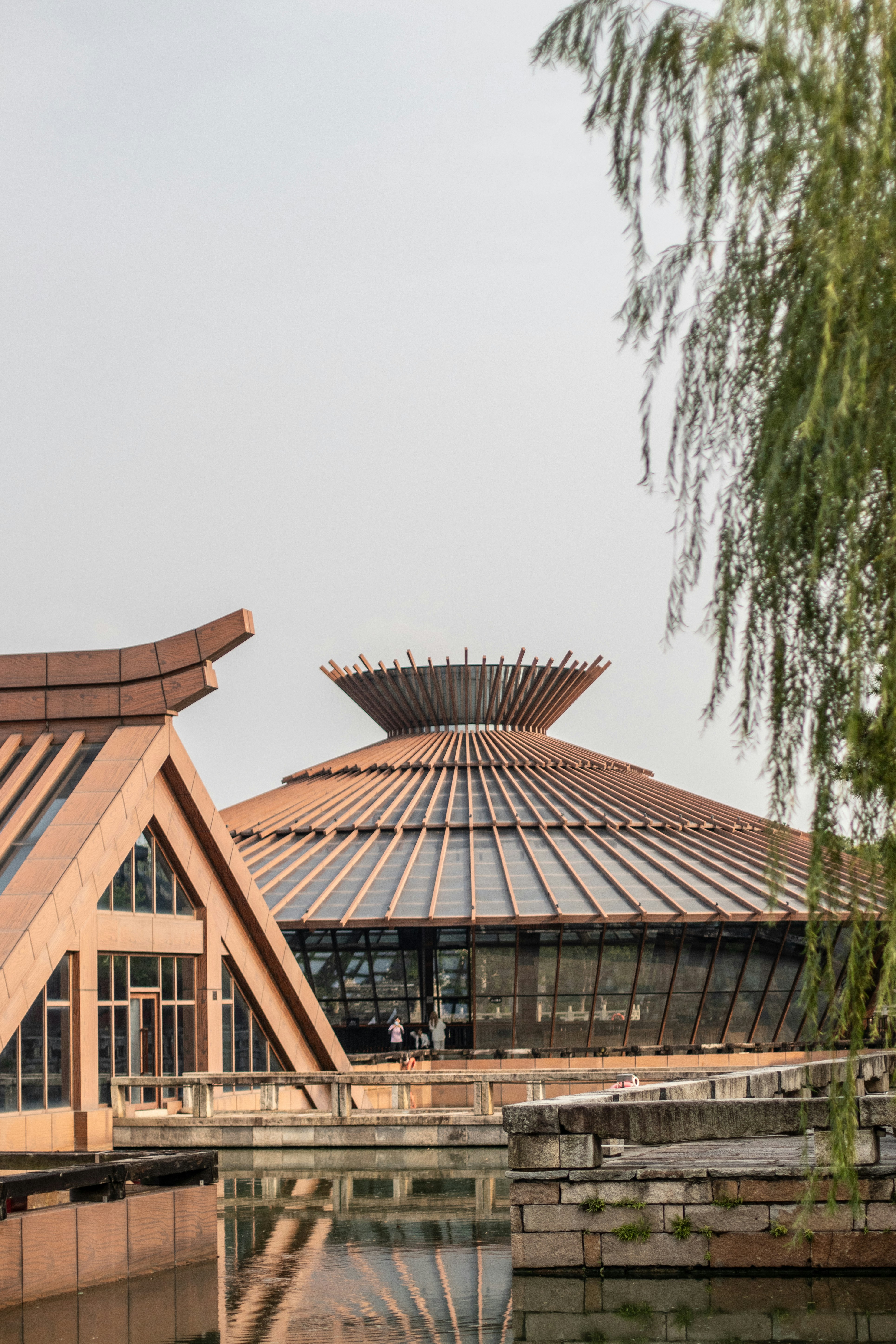 Modern circular building with glass walls and rooftop photo – Free ...