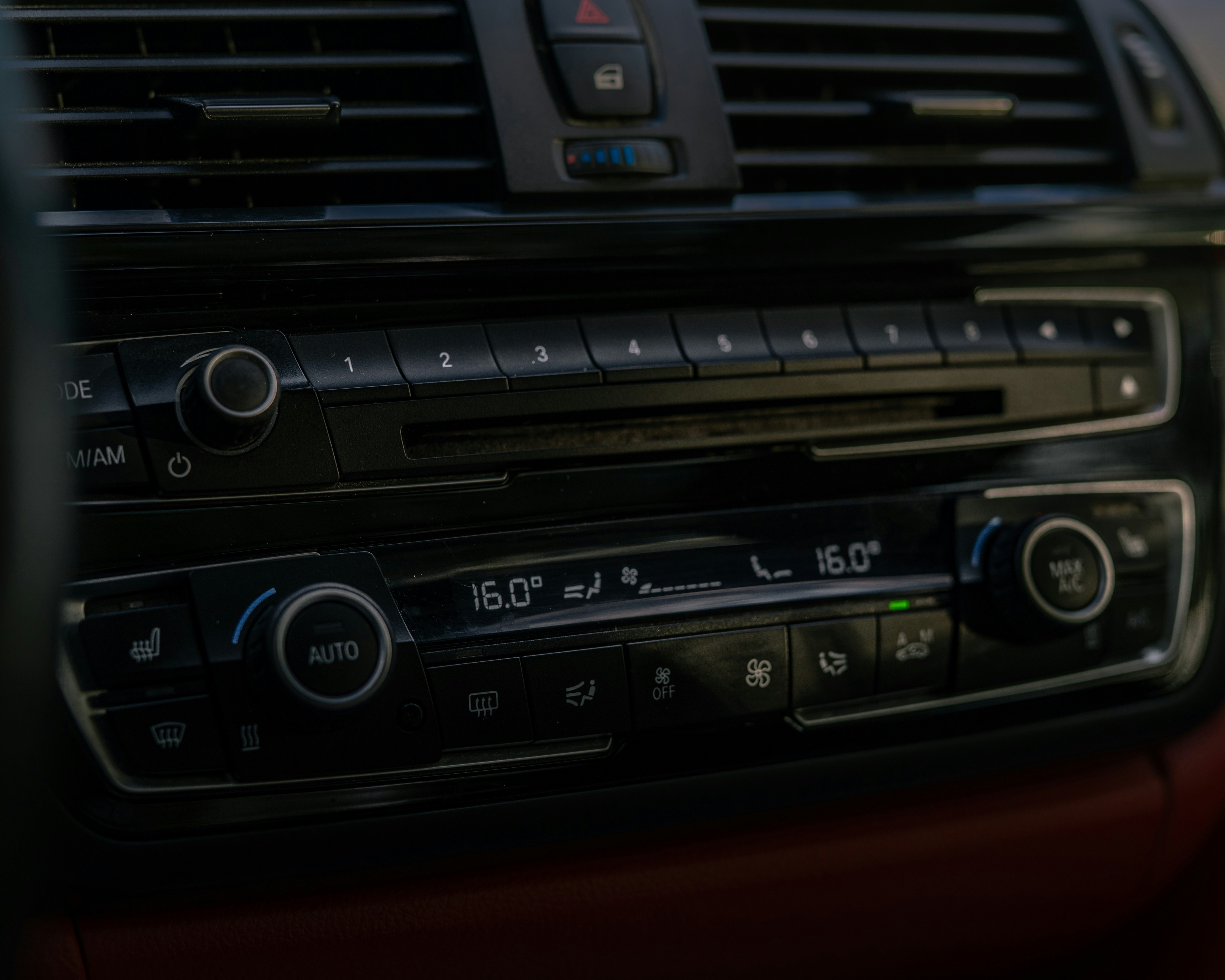 Close-up of modern car's climate control panel.