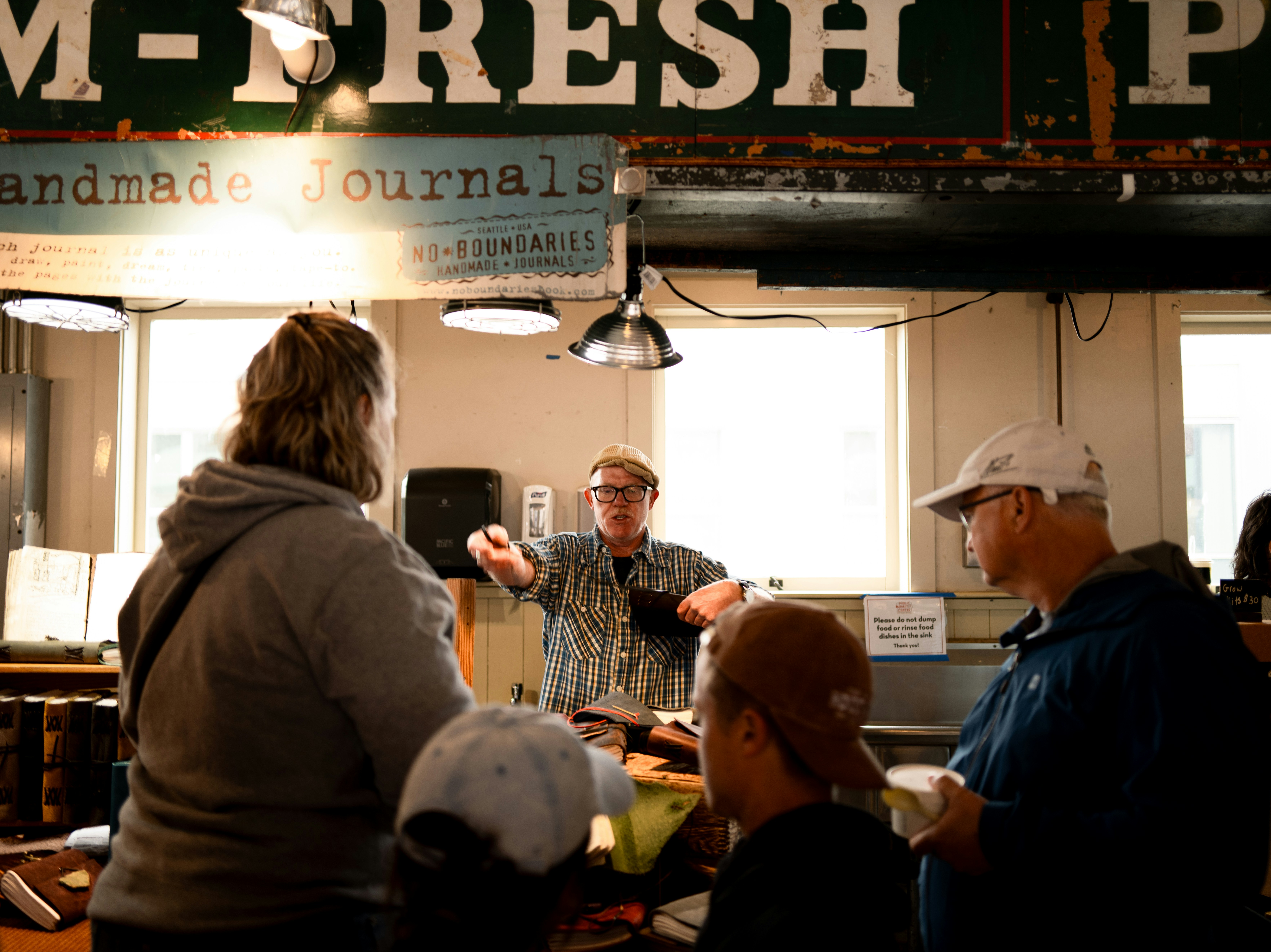 People interacting at market stall