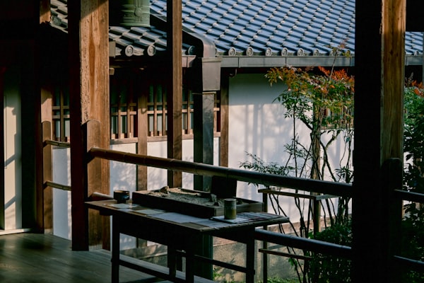 Kyoto — wooden balcony overlooking a tranquil garden, Aman Kyoto style