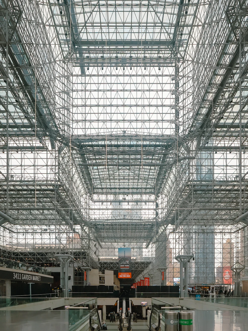 Glass and steel atrium with escalators in a commercial building