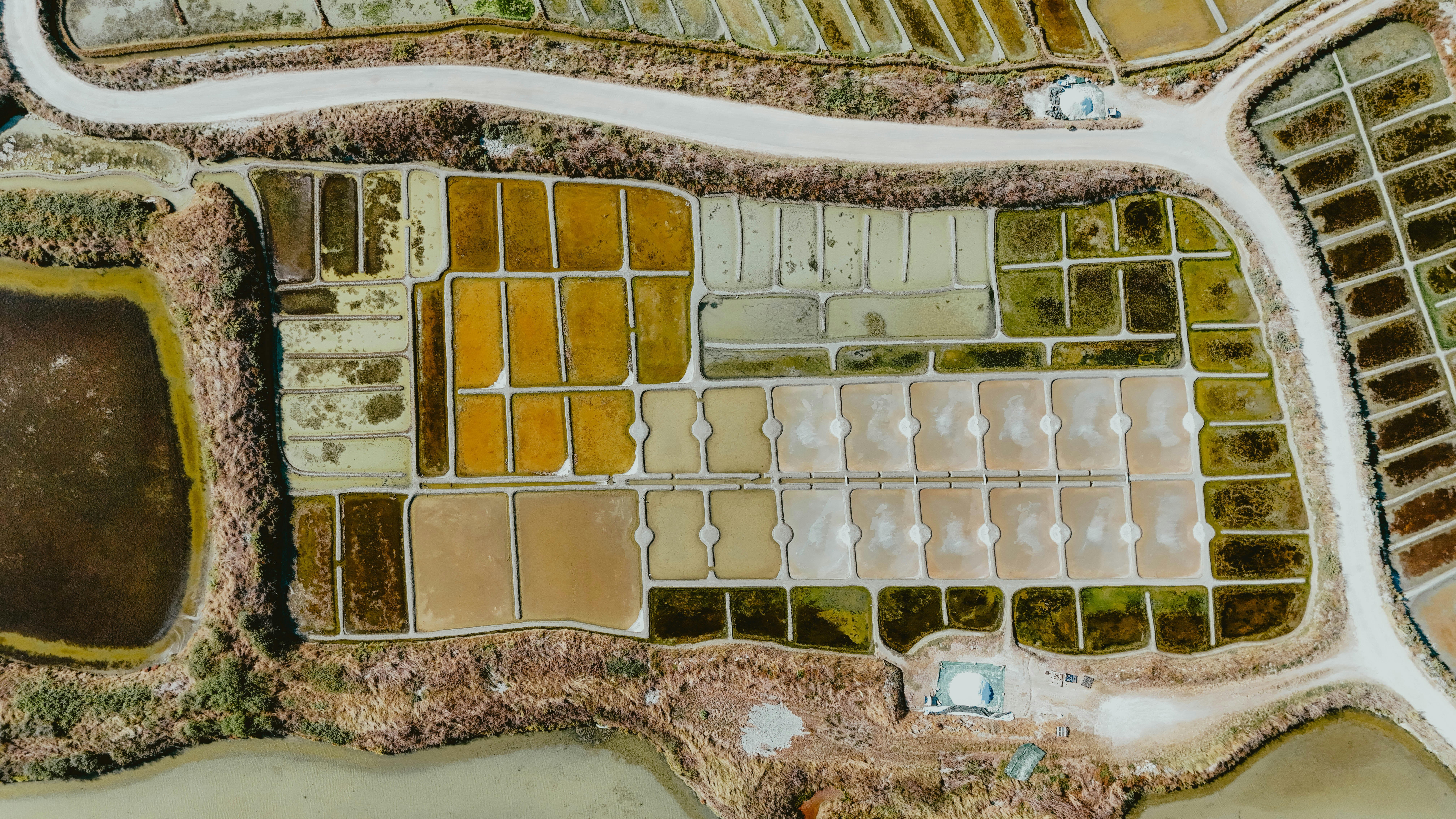 Aerial view of colorful salt evaporation ponds.