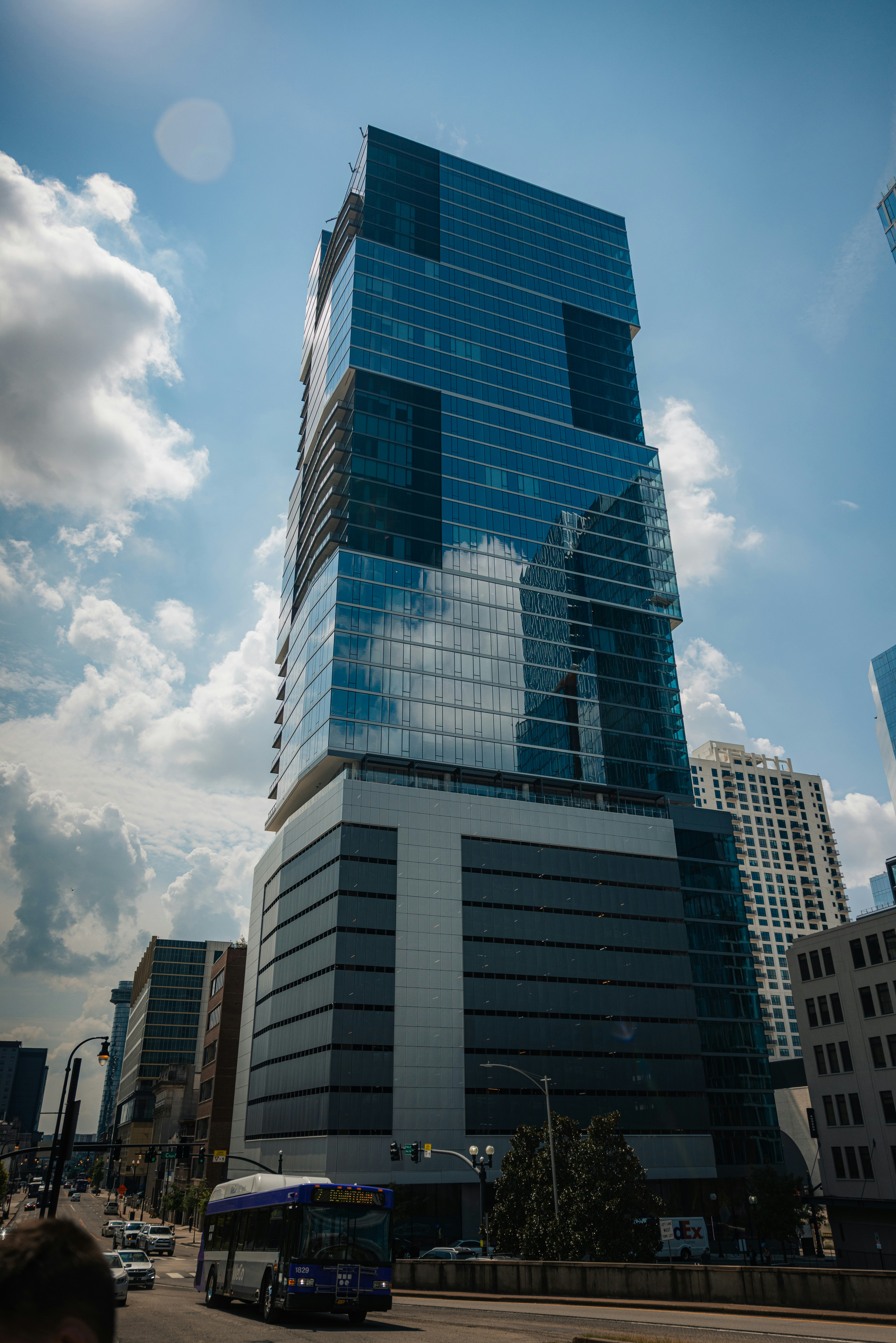 Modern skyscraper with glass facade against blue sky