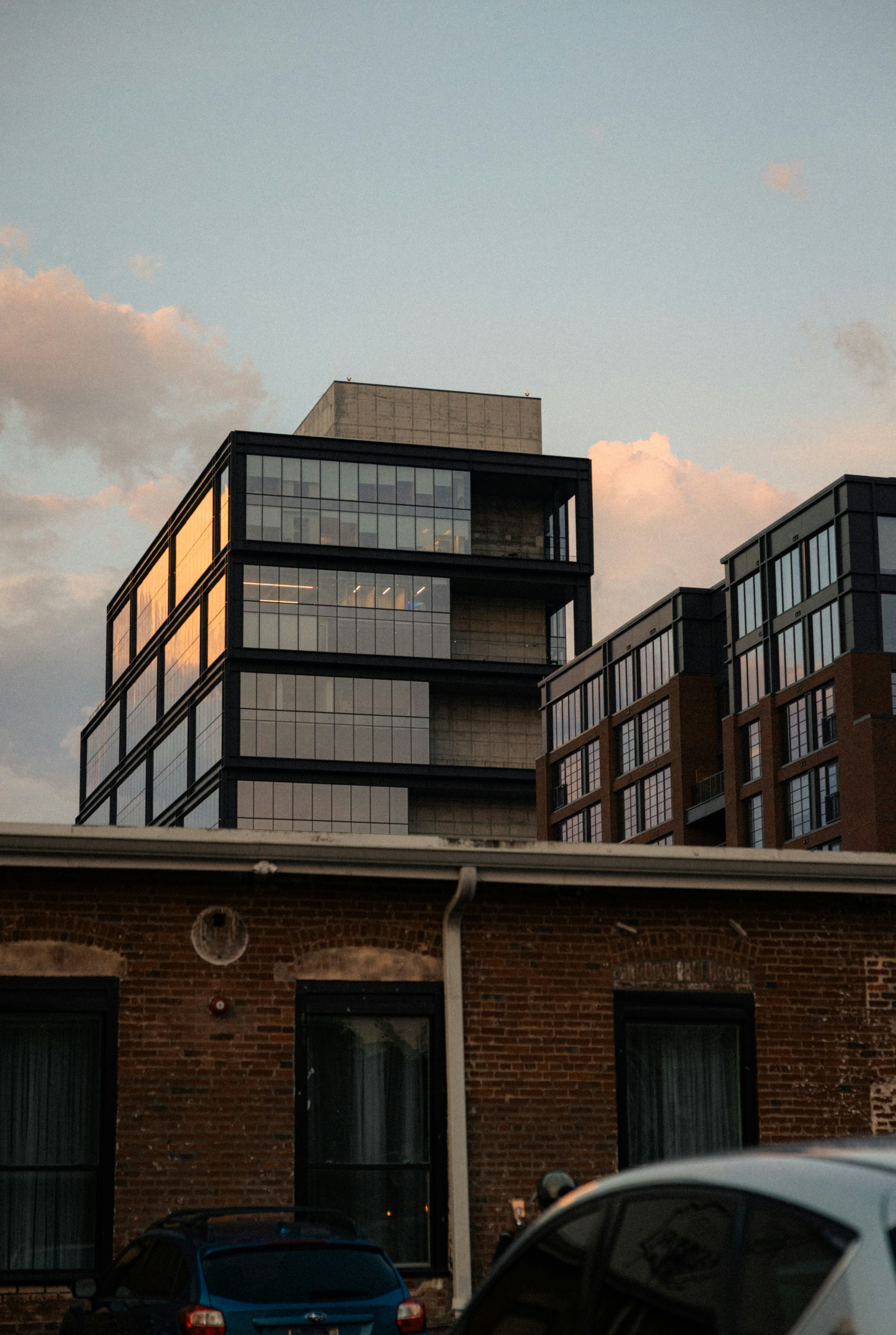 Modern buildings with glass facades against sky