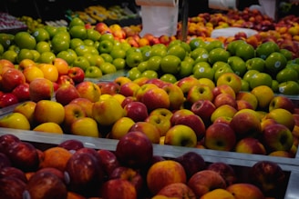 Variety of fresh fruits displayed at a market.