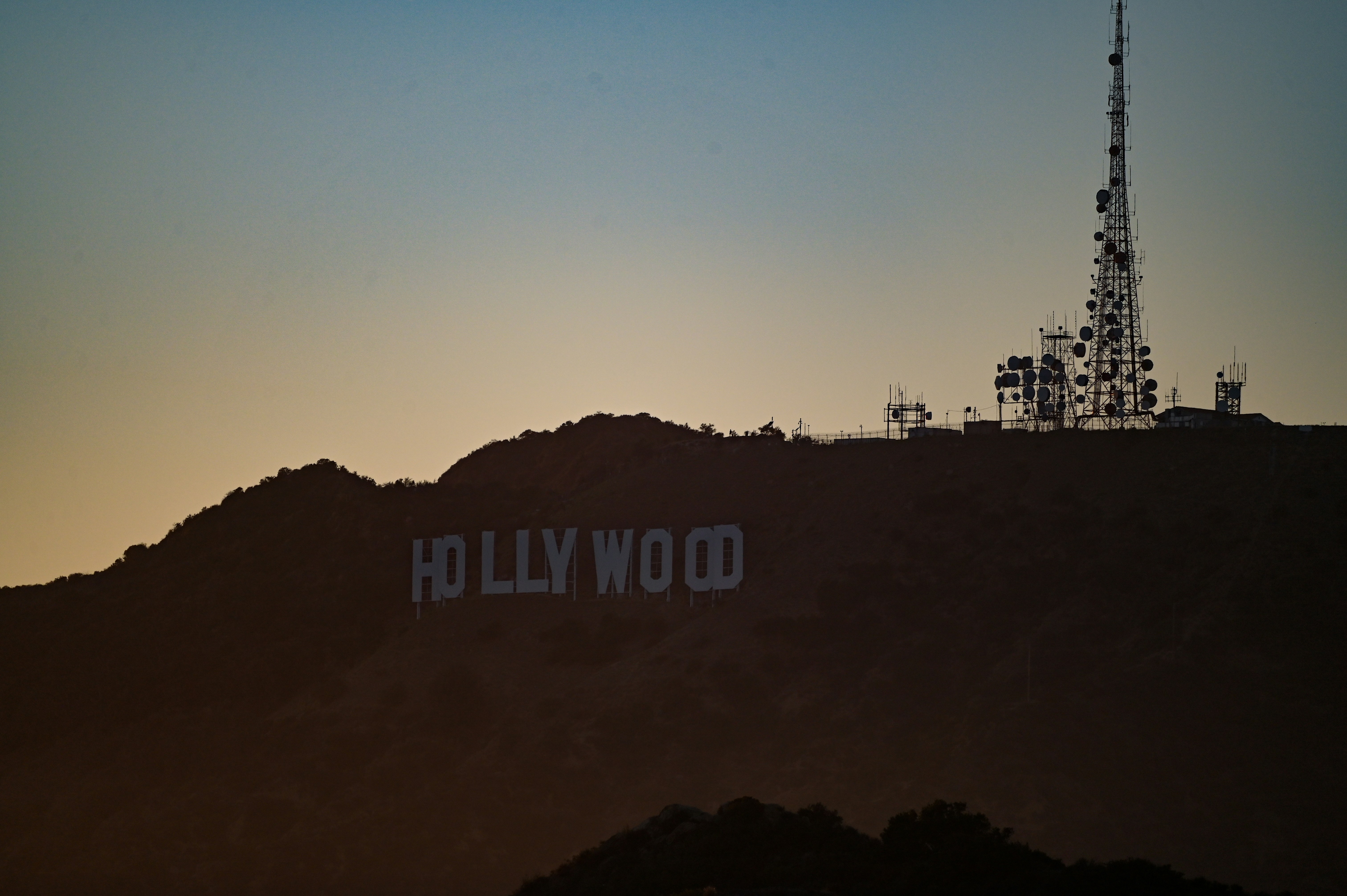 Hollywood sign on a hill at sunset
