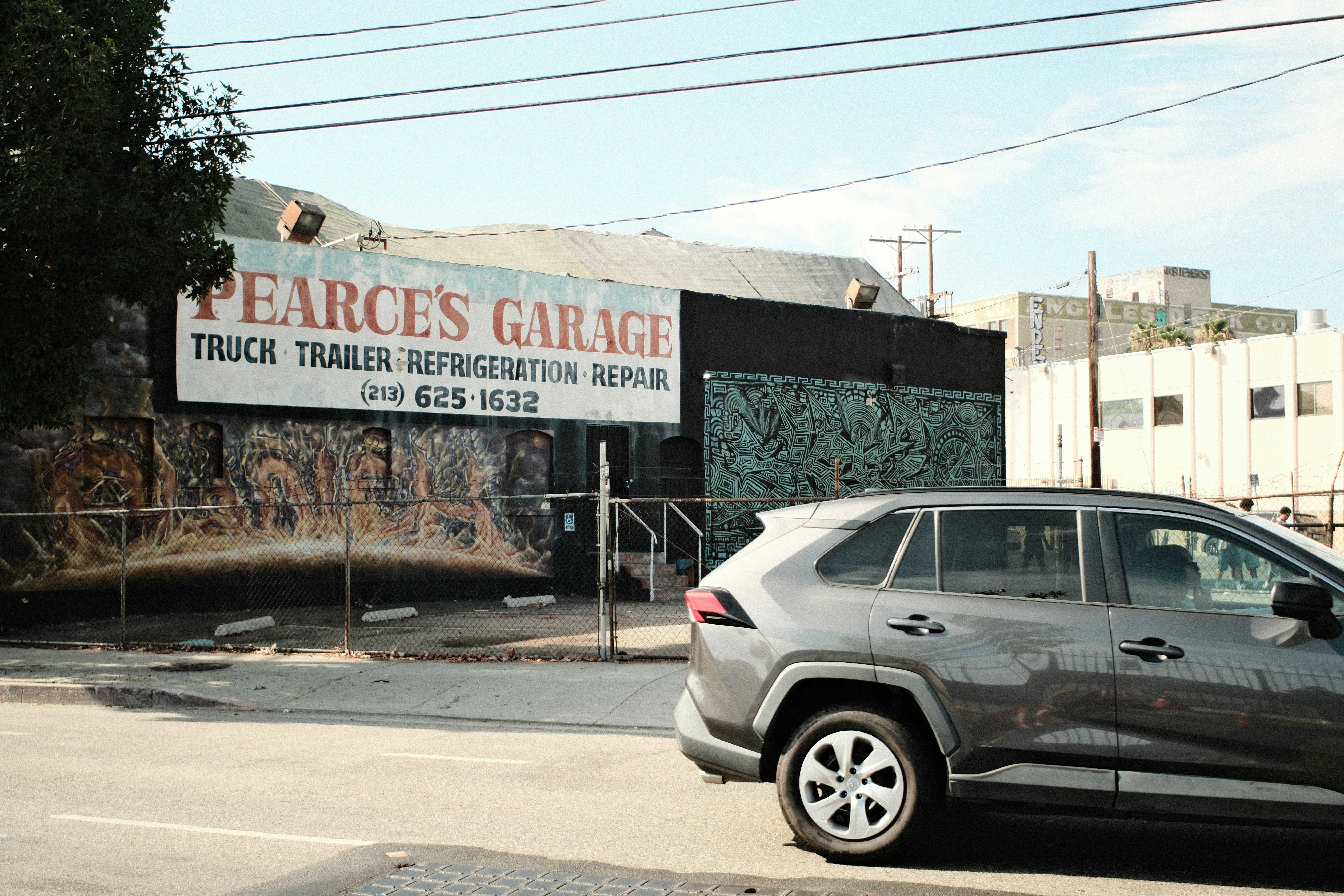 Pearce's garage advertises truck, trailer, and refrigeration repair.