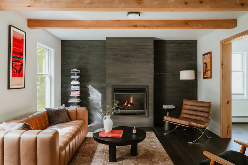Modern living room with leather sofa and fireplace
