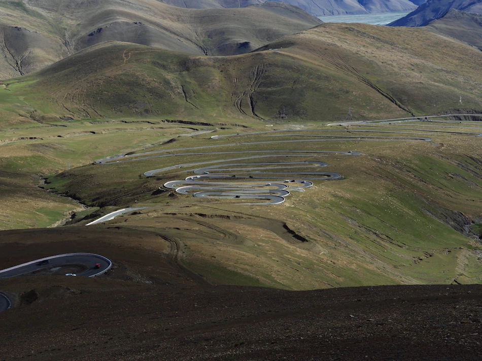 A winding road crosses high hills on the approach to Mount Everest