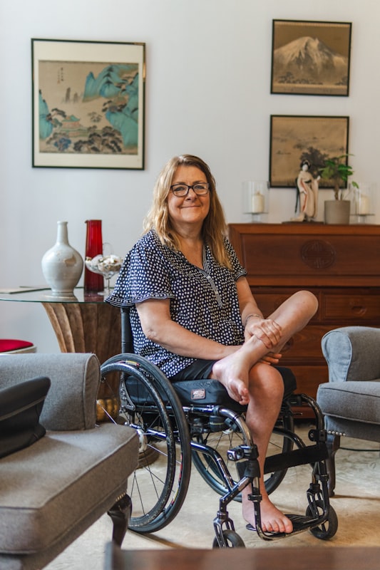 Happy participant smiling in a wheelchair