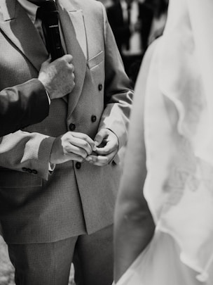 Officiant holding microphone during wedding ceremony