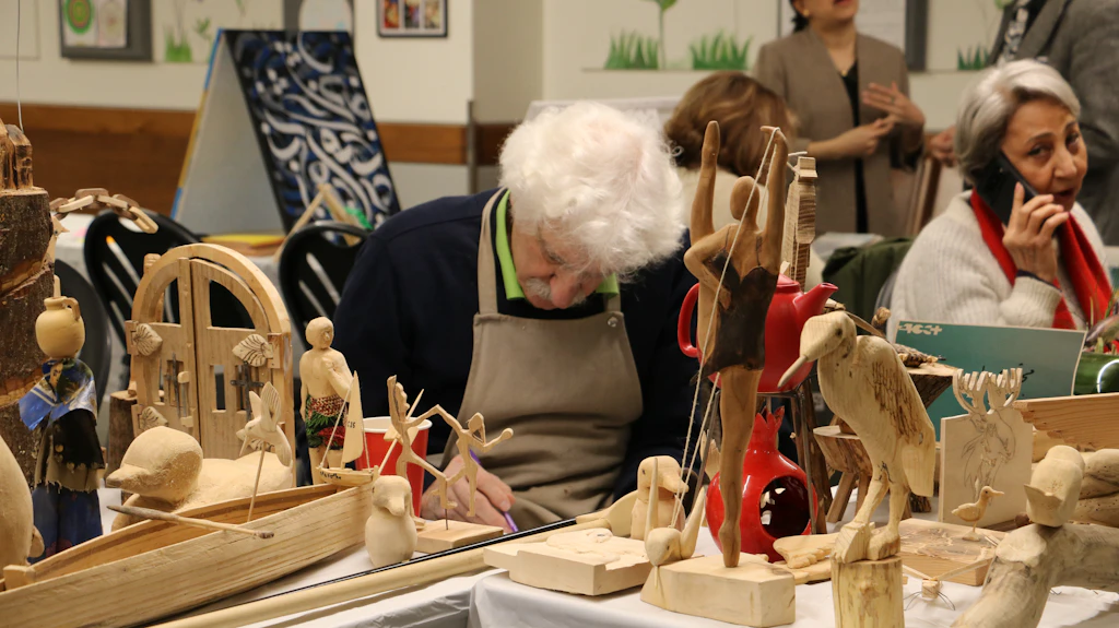 Hands crafting a scenic prop with detailed fabrication work