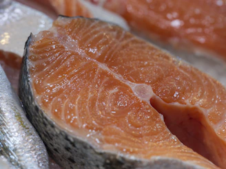 Close-up of fresh salmon steaks on ice