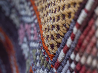 Close-up of colorful woven fabric with intricate patterns.