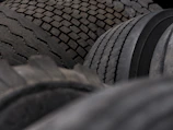 Close up of stacked truck tires with worn treads