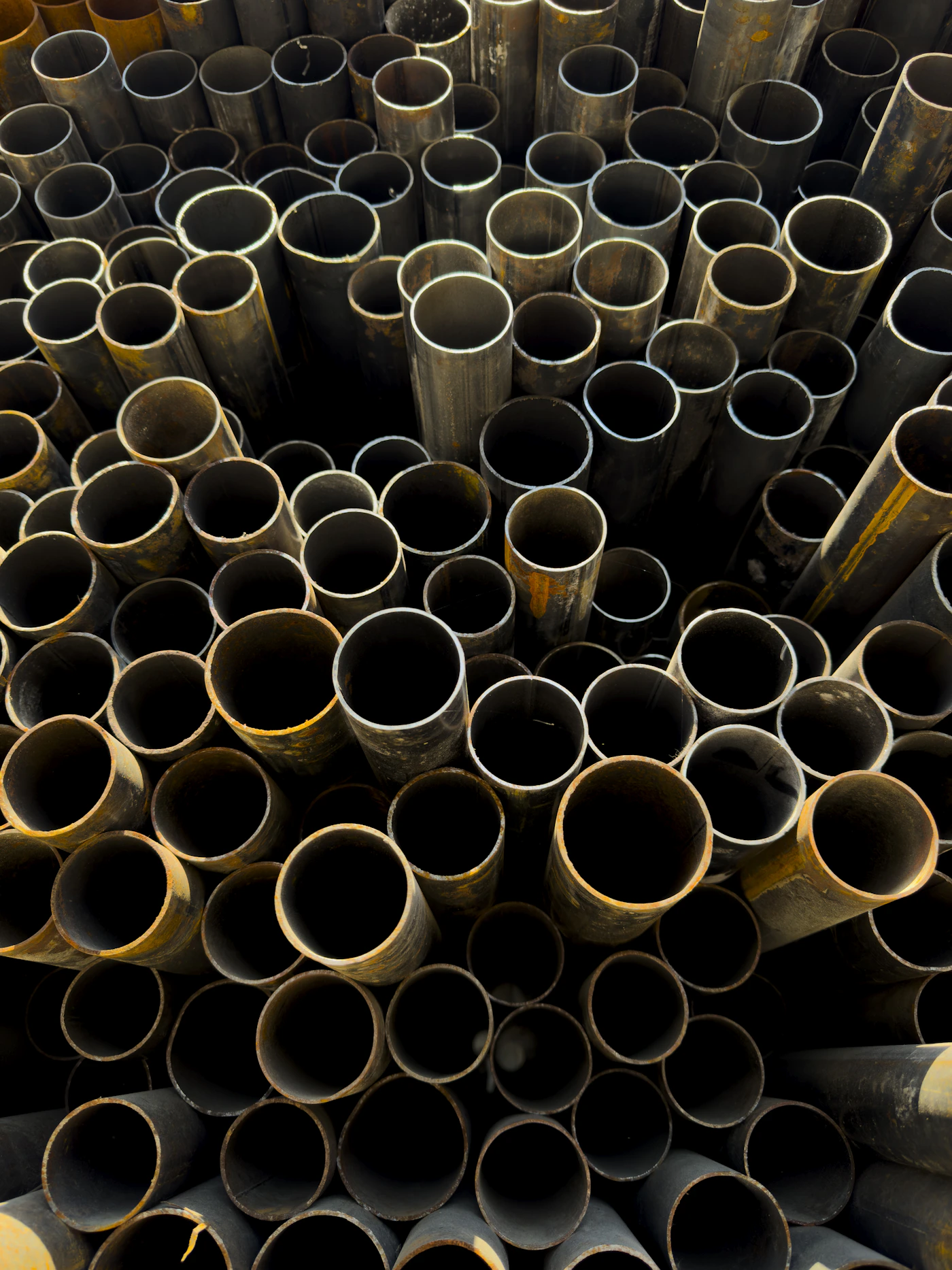 Large hollow metal pipes viewed from above