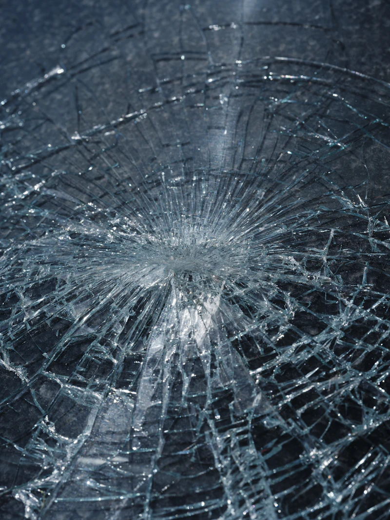 Close-up of a small chip and crack in a windshield