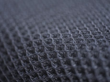 Close-up of a dark textured fabric pattern