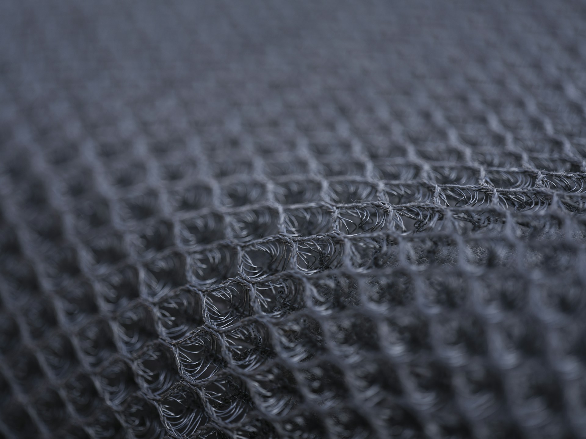 Close-up of a dark textured fabric pattern