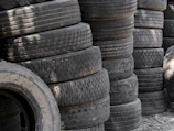 Stacks of old used car tires piled up